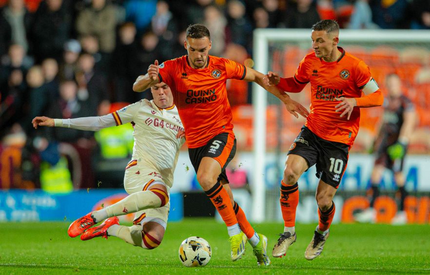 Vicki Sevelj and David Babunski in action for Dundee United.