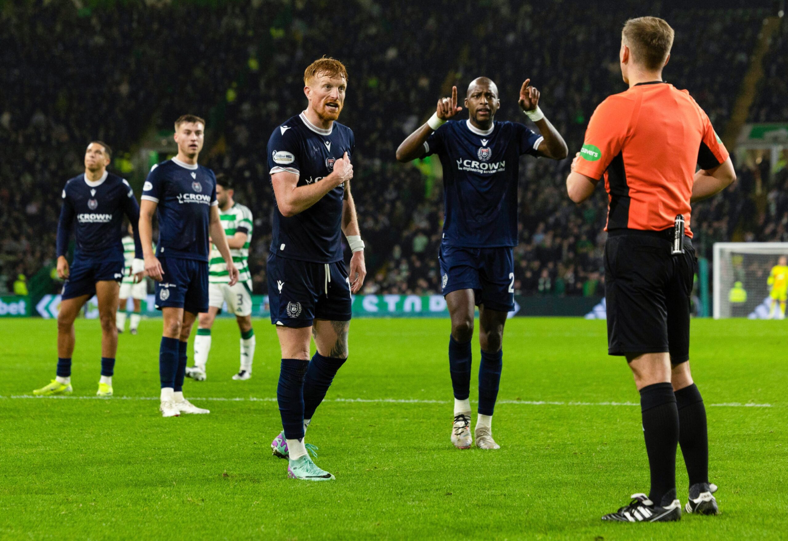 Dundee appeal to Ross Hardie after the referee awarded Celtic a second-half penalty. Image: Craig Foy/SNS