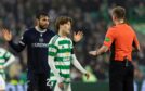 Referee Ross Hardie awarded Celtic a penalty for an Antonio Portales (left) tug on Kyogo Furuhashi. Image: SNS