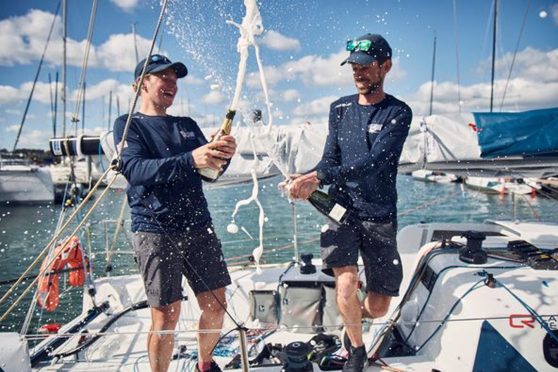 Angus yachtsman Calanach Finlayson and Shetland's Maggie Adamson celebrate their world championship. Image: Supplied