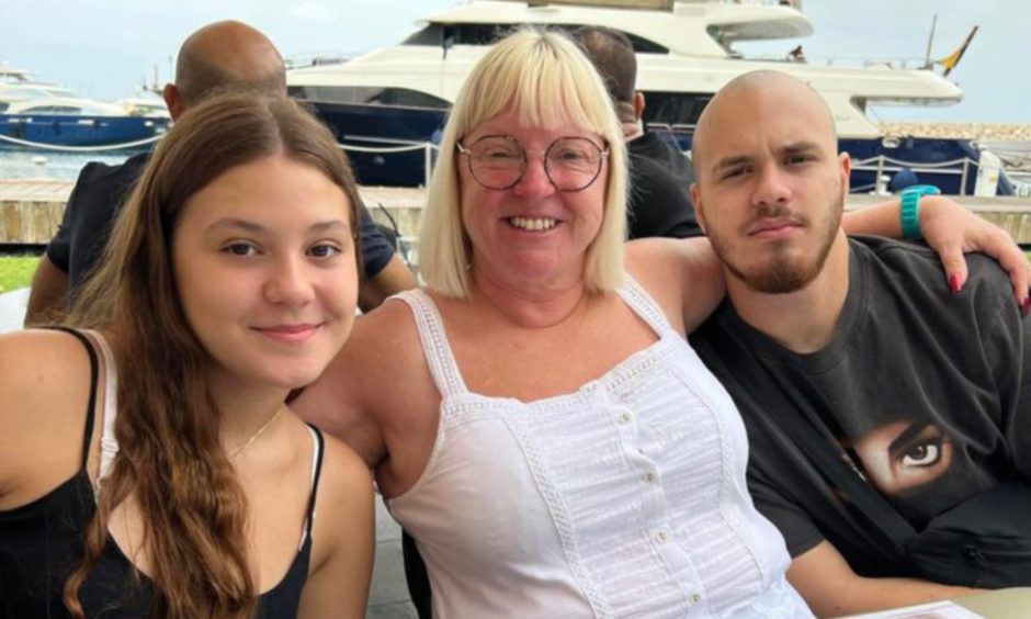 Debbie Mitchell (centre) with niece Rebecca and nephew Thomas.