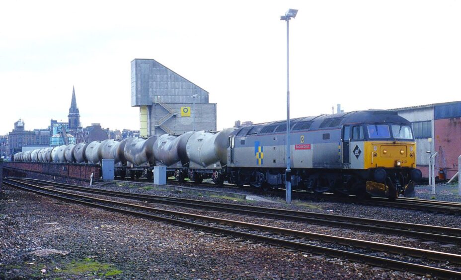 A train of cement hoppers feeding into the then-terminal. 