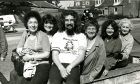 Billy Connolly poses for a photo with fans while in Dundee on his charity run in 1980.