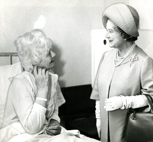 Miss Amy Todd chatting to the Queen Mother in October 1974.