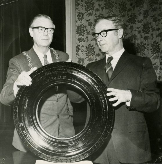 Thomas Ferguson of Michelin and Lord Provost Fitzgerald with the first tyre.