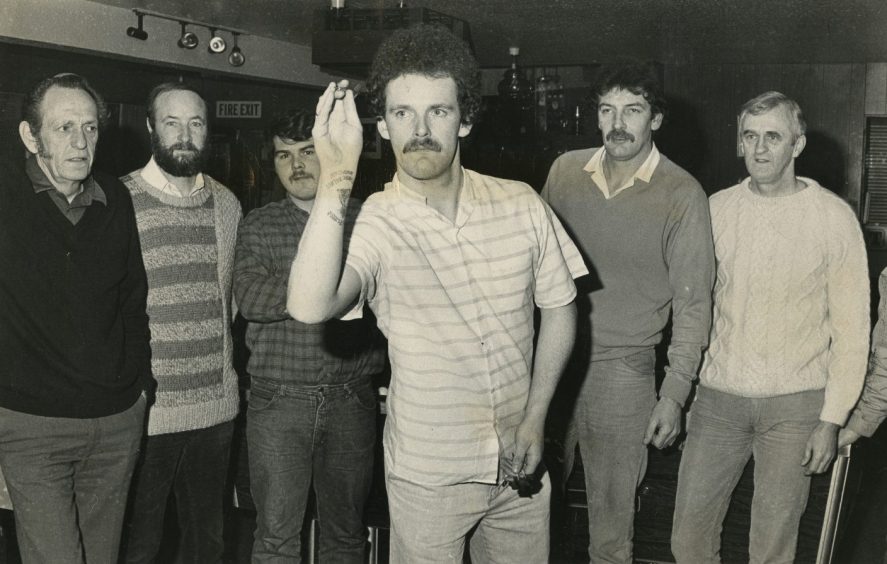 Calum Brunton at the oche during the Dundee darts fundraiser. 