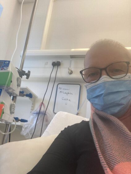 Alison pictured in hospital during her treatment for breast cancer.