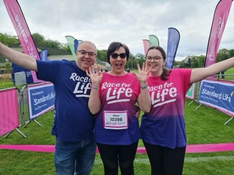 Alison was invited to launch the Stirling Race for Life event after she completed her treatment for breast cancer. She is pictured with husband Paul and daughter Kerry