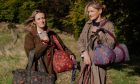 Perthshire designers Antonia (left) and Susanna standing outside with their first collection of block print and tartan weekend bags Image: Katie Pryde