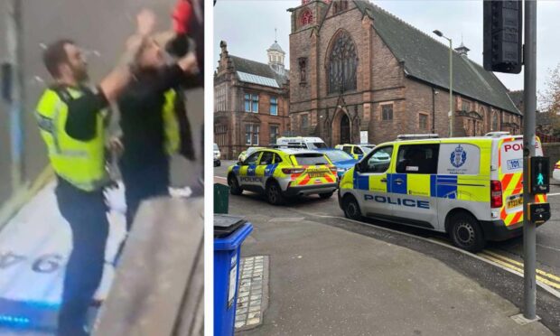 Police climbed onto the roof of a van during the disturbance on Arthurstone Terrace, Dundee. Image: Ben MacDonald/DC Thomson/Supplied