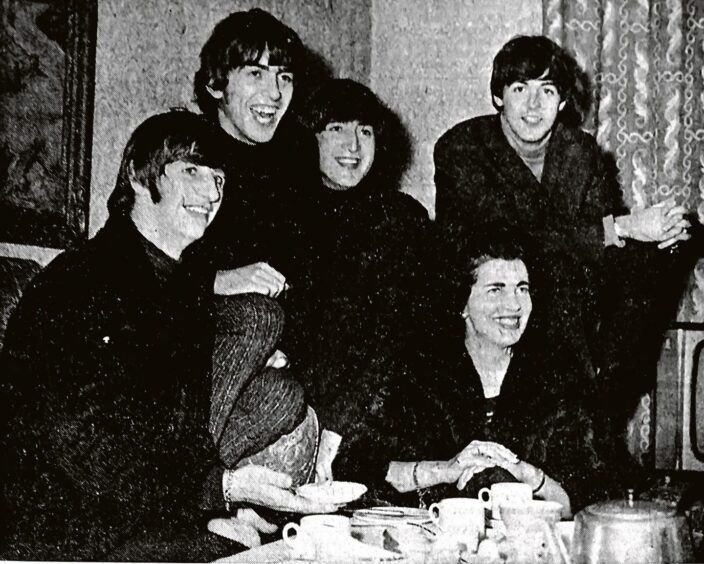 The Beatles enjoying tea with the Countess of Strathmore before their 1964 Dundee show