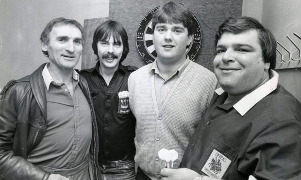 Darts world champion Jocky Scott with Clem Dane, Philip Martin, and Hugh Christie at the Dolphin in Fintry, Dundee, in 1983.