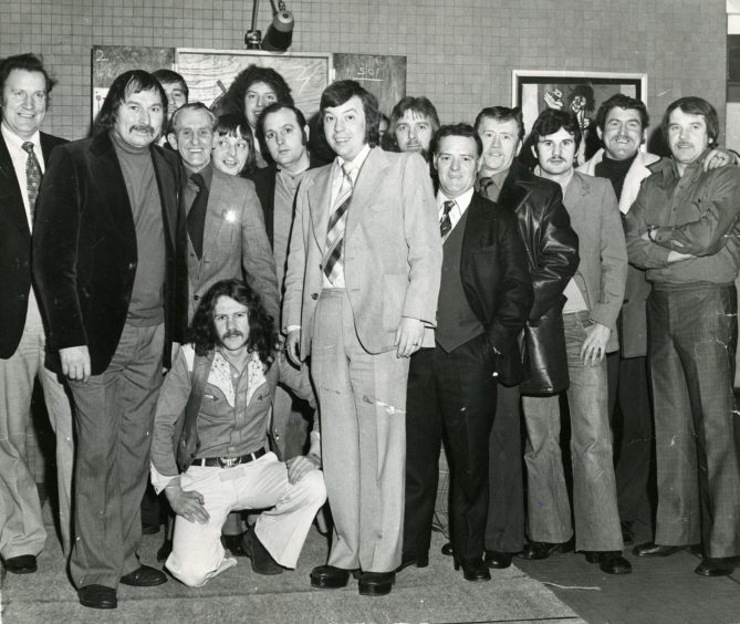 Harry Heenan and Alan Evans alongside fans in 1976. 