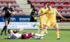 Dunfermline's Matty Todd is challenged by Kelty Hearts' Ross Cunningham.