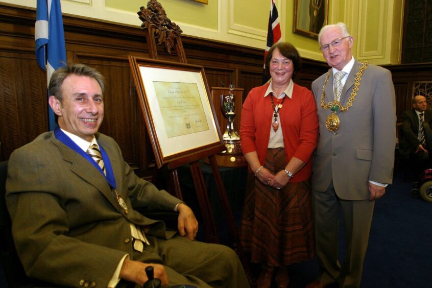 John Mitchell pictured with dignitaries after becoming Dundee citizen of the year in 2007.