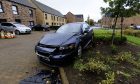 One of the damaged cars on Kestral Way in Perth. Image: Phil Hannah