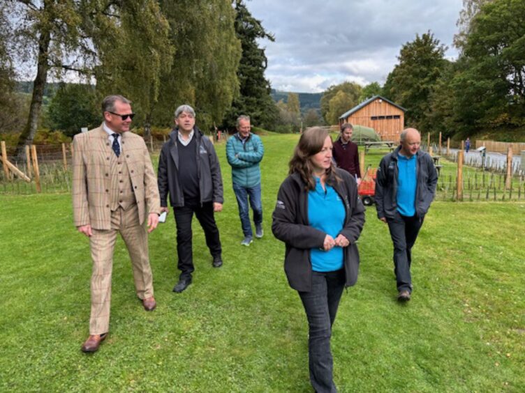 Group of people walking through Grandtully Station Park