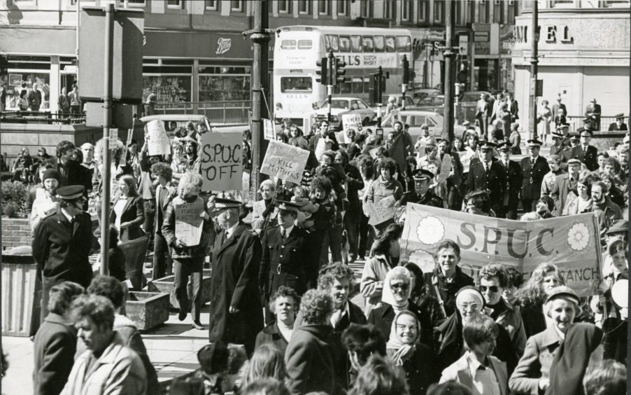 SPUC members are met by rival protestors in 1979.