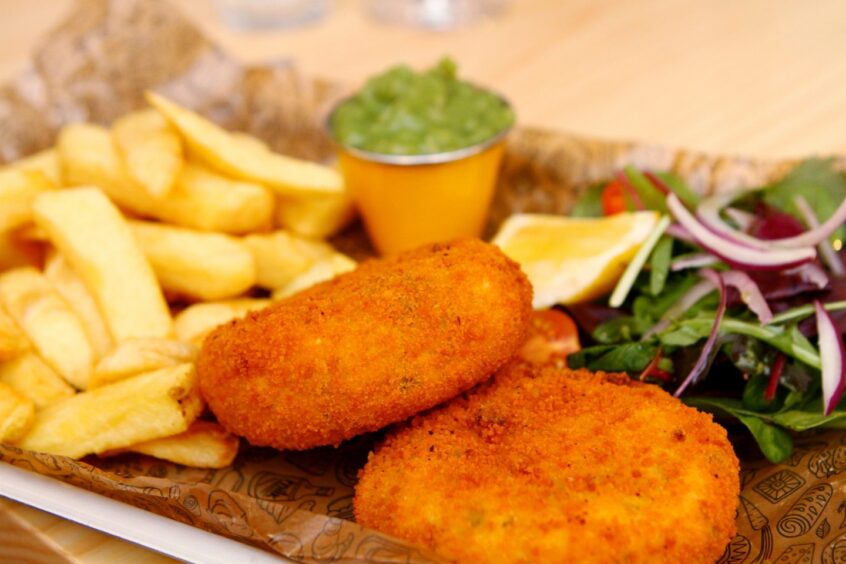 A photo of fishcakes, chips and mushy peas from The Tailend in Dundee.