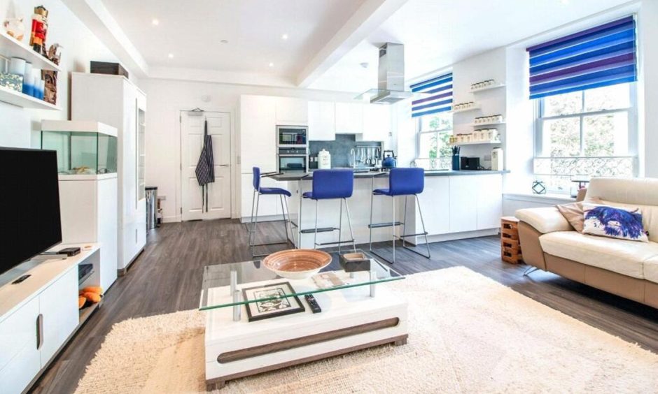 Modern open plan kitchen and lounge in Dundee flat.