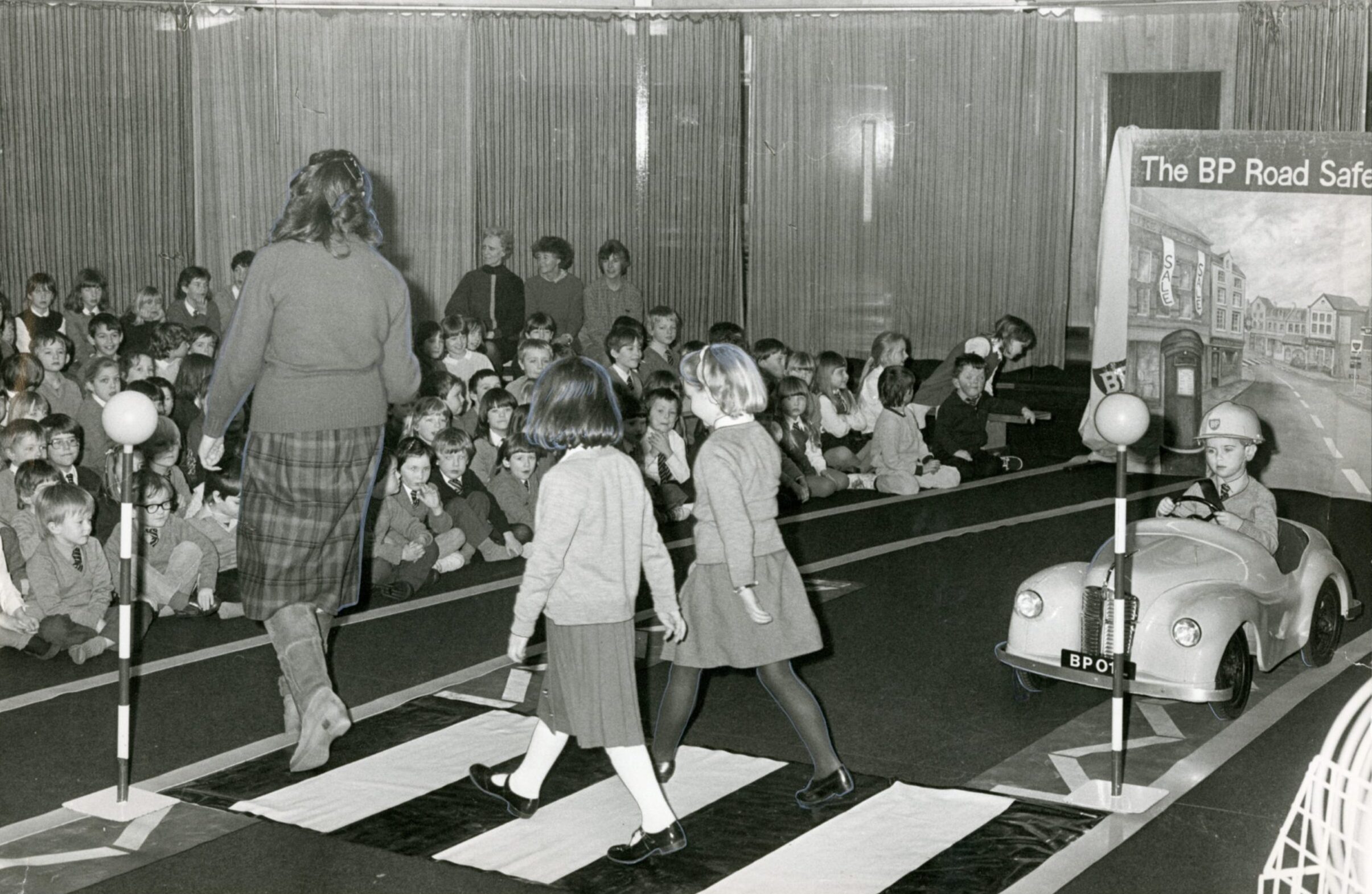 Children watch a re-enactment of the proper use of a Zebra crossing during a road safety presentation at Newport-on-Tay Primary School in January 1987.