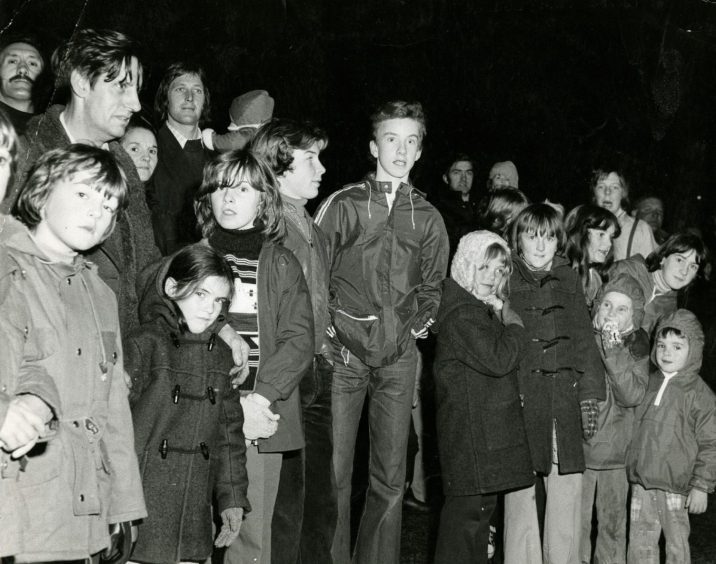 Children look on at the bonfire during the Dundee fireworks display in 1976. 