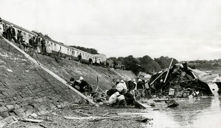 Firefighters used ladders to get down and help the injured after the rail crash. 