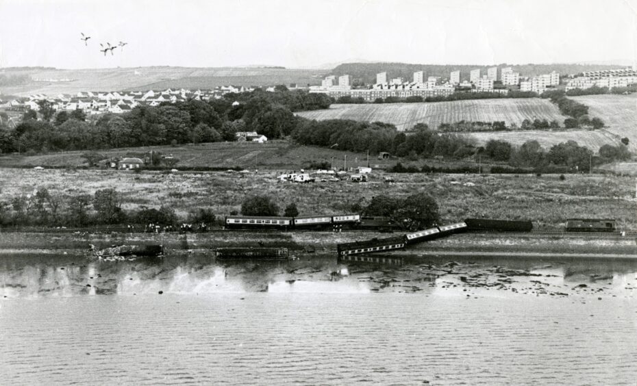 A view from over the River Tay of the train crash and derailed carriages.