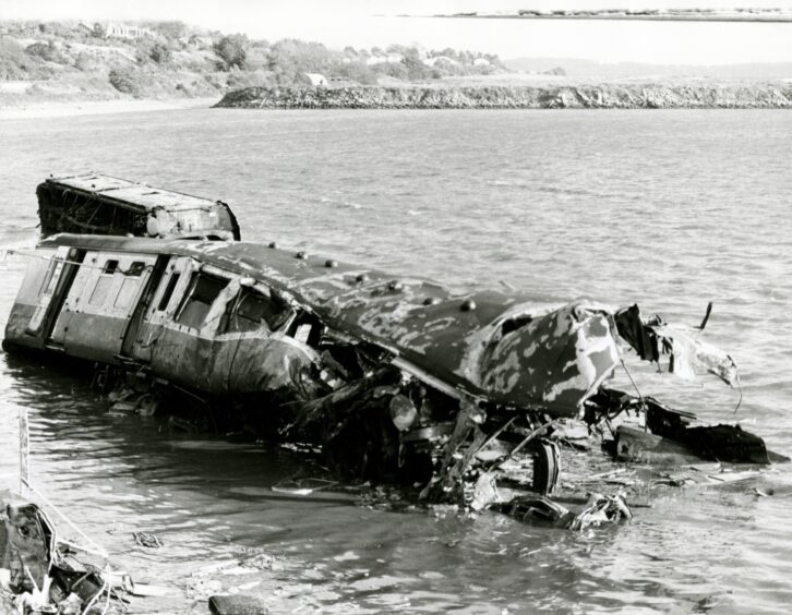 A rail carriage almost submerged by the River Tay in October 1979.