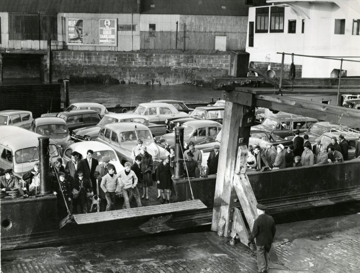 The Newport-on-Tay boat arriving in Dundee packed with cars and people in April 1964.