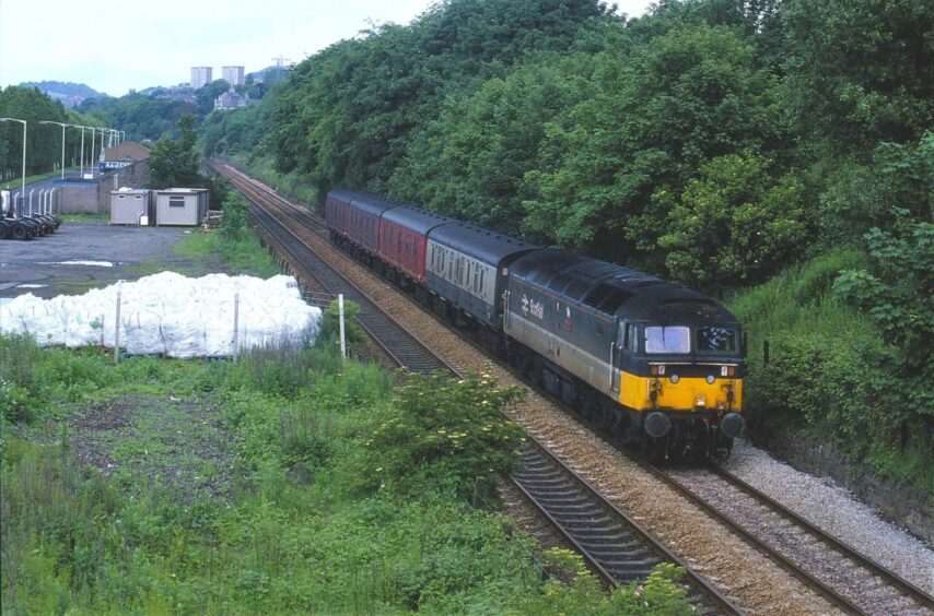 47704 Dunedin comes north with a parcels train