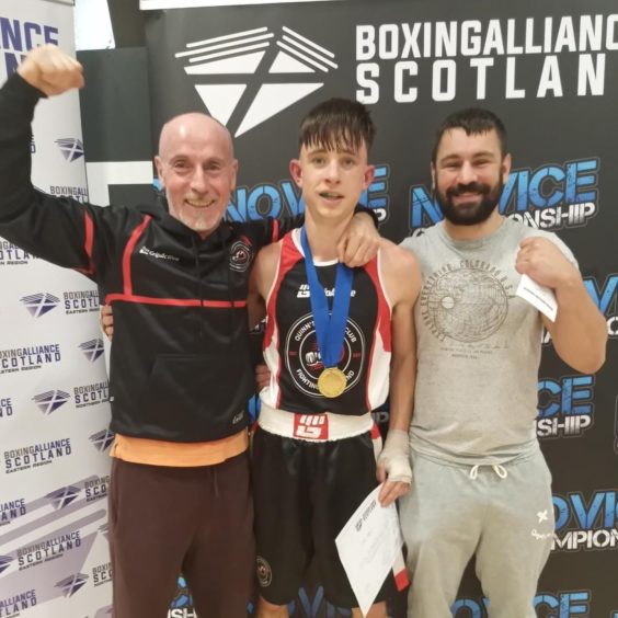 Kieran Quinn (left), Finlay Adams and Monty Ogilvie celebrates Finlay's crowning as Scottish Novice Champion in Dundee.