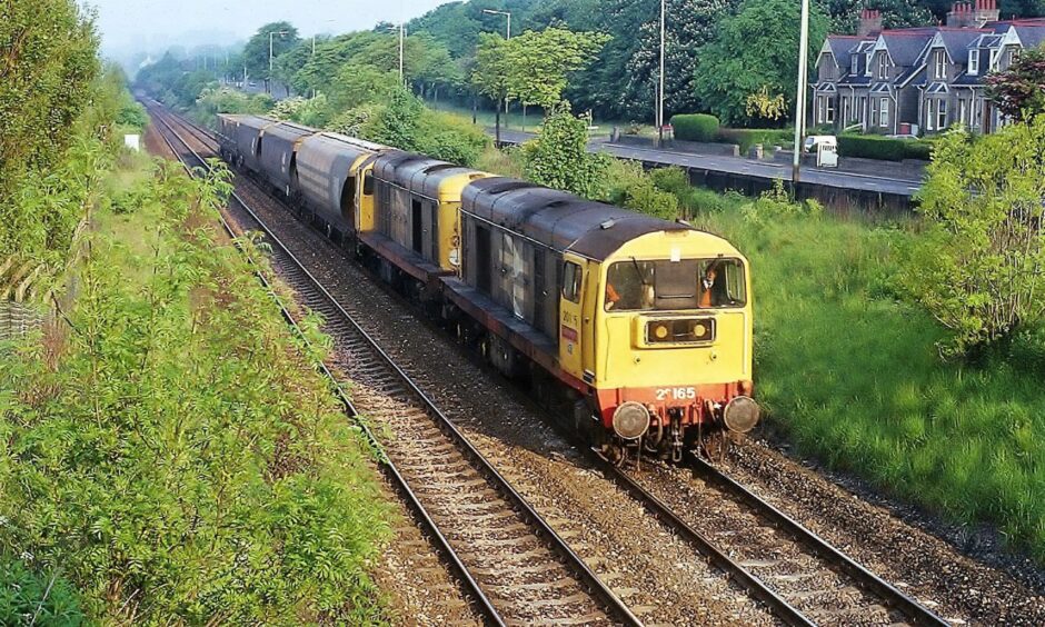 No. 20165 and 20118 come past with the Montrose local freight around 7am on June 6 1991 in this photograph taken from the Dundee Road overbridge.