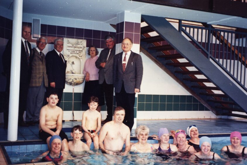 Adults and children gather at the reopening of Lochee Baths. 