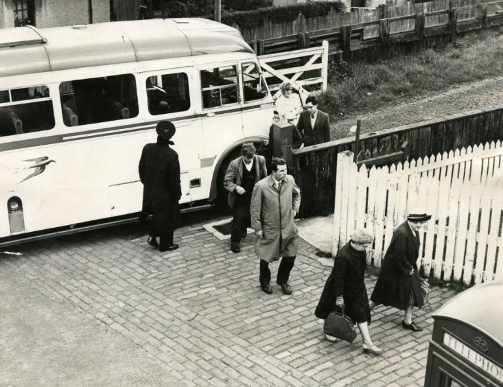 Passengers on the Newport-on-Tay train bus walking from the bus to the station.