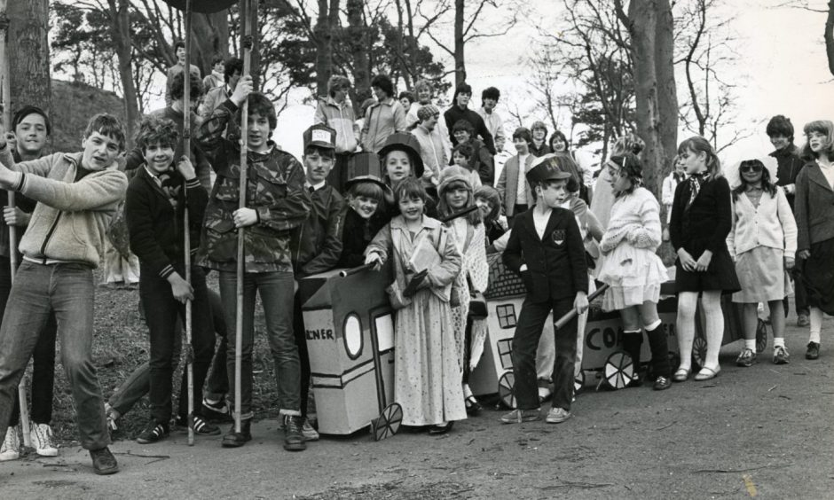 Youngsters from the Rio Youth Centre in Newport pose for a picture while taking part in a street parade in 1984.