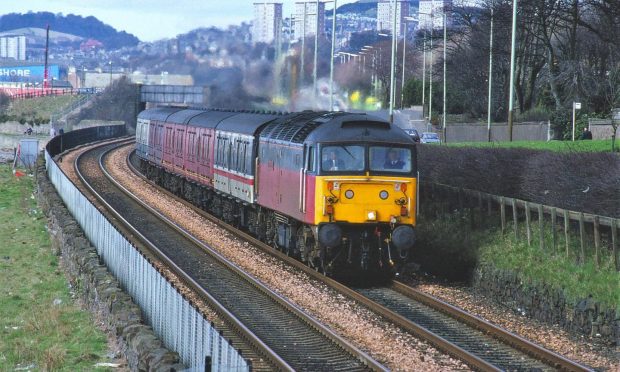 47703 The Queen Mother brings a northbound parcels train along the Grassy Beach in March 1991. Image: Scott Cunningham.