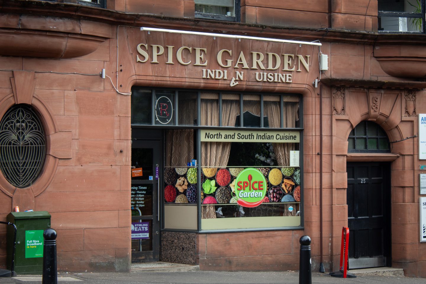 Red stone exterior of Spice Garden Indian restaurant in Stirling