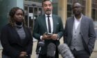 Solicitor Aamer Anwar alongside Skehu Bayoh's sister Kadi Johnson (left) and brother-in-law Ade Johnson (right)