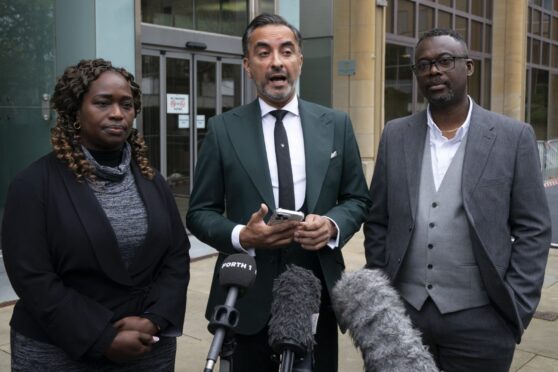 Solicitor Aamer Anwar alongside Skehu Bayoh's sister Kadi Johnson (left) and brother-in-law Ade Johnson (right)