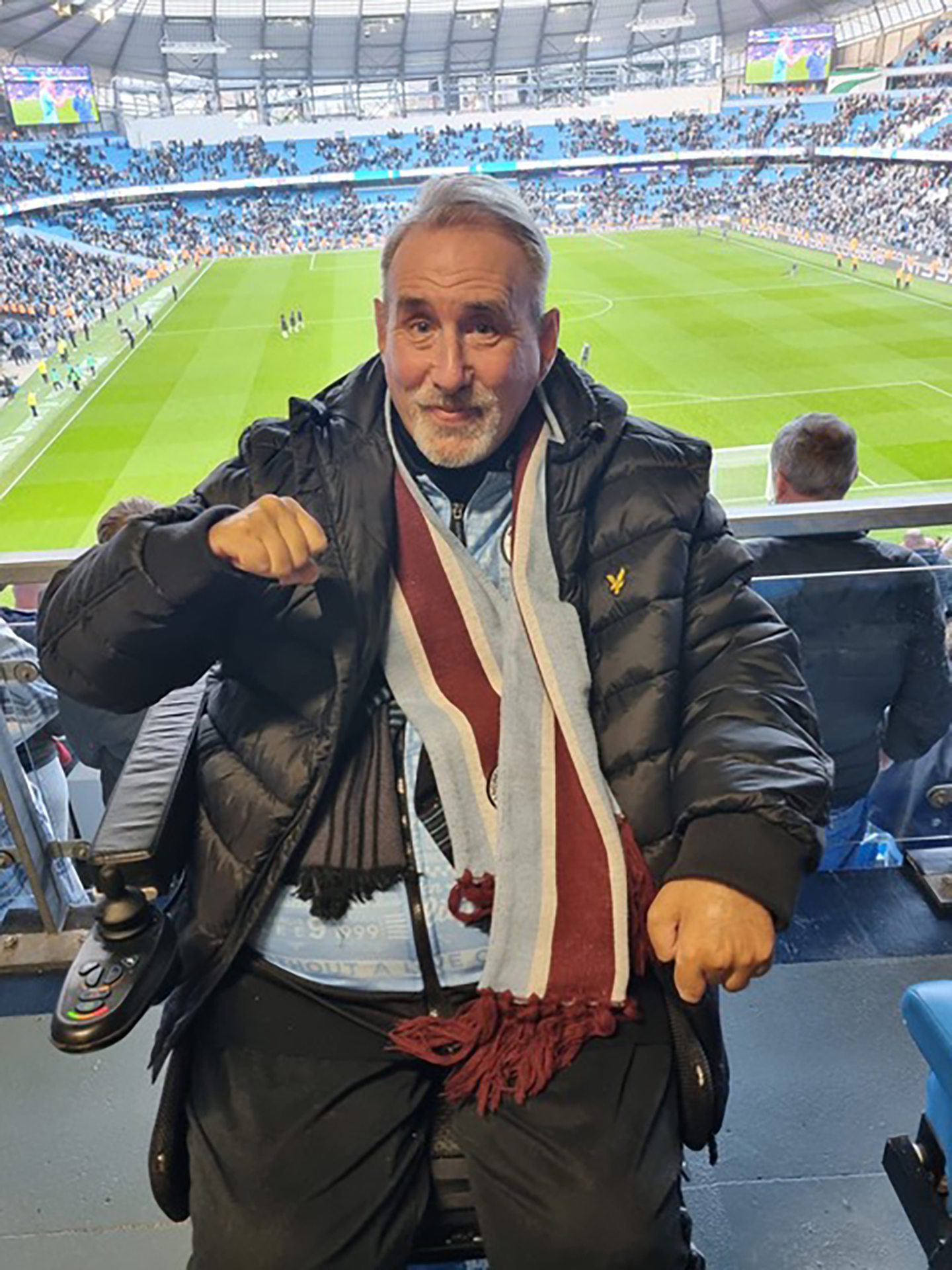 John Mitchell watching Manchester City at the Etihad Stadium. 