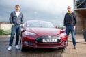 Chris and Jack with the 10-year old Tesla. Image: Kim Cessford.