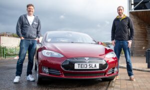 Chris and Jack with the 10-year old Tesla. Image: Kim Cessford.