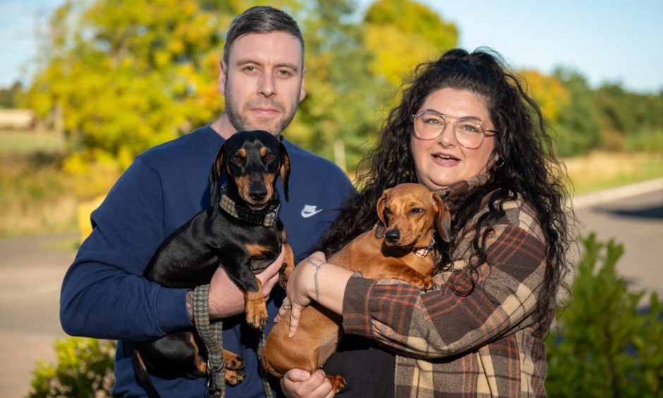 Ross Archbold and Angie Munro with sausage dogs Chester and Olive at home in Arbroath. Image: Kim Cessford.