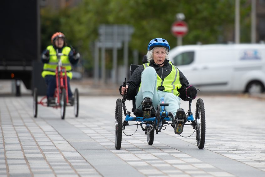 Janice Rae uses one of the Dundee Dragons' 37 adapted trikes.