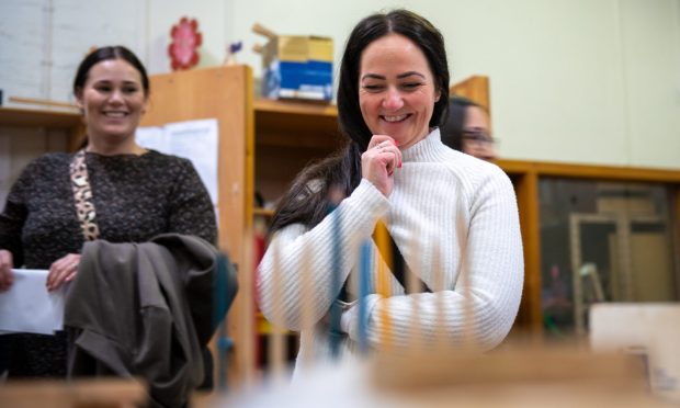 Two Iceland teachers watch a STEM class at Craigie High