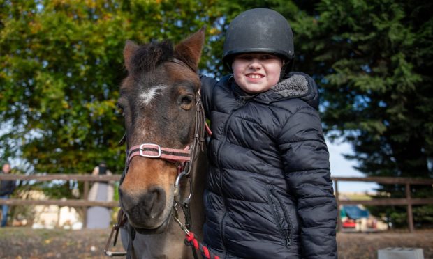 Rebecca and her partner Steven suited up at Axed and Enraged, Dundee. Image: Kim Cessford/DC Thomson.