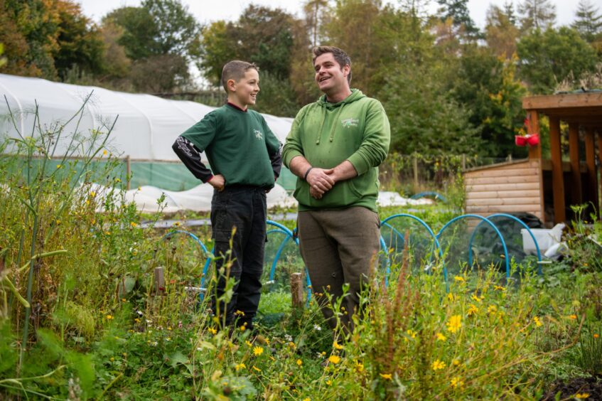 Oscar and Andy chatting in the garden.