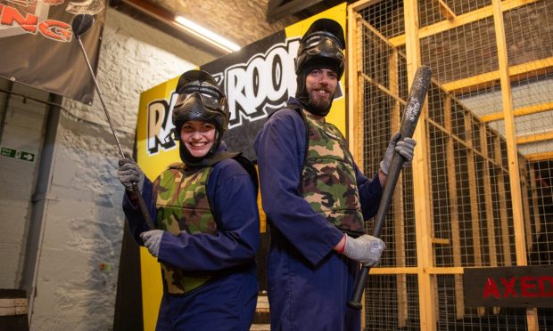 CR0050245, Rebecca Baird, Dundee. Photos of Rebecca for first-person wellbeing feature on Rage Room. Getting kitted up, and action shots of smashing stuff and cathartic screaming. Picture Shows; Rebecca and Steven following their experience in the Rage Room, Axed & Enraged, North Isla Street, Dundee, 16th Oct 2024. Image: Kim Cessford / DC Thomson