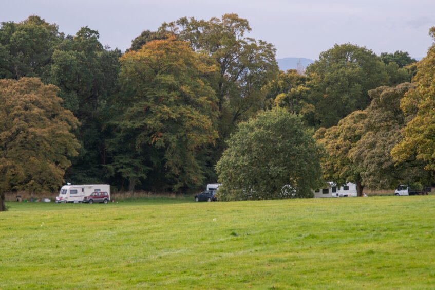 At least five caravans are at the site.